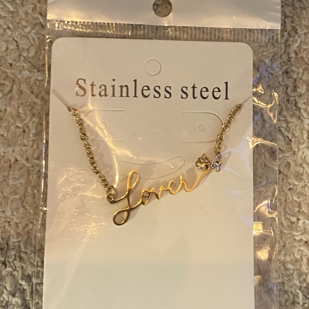 New. LOVER Taylor Swift album necklace. Stainless steel in gold.